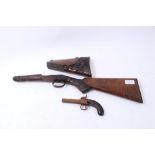 19th century percussion pocket pistol and two 19th century Continental carved walnut gun stocks (3)