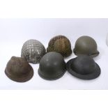 Collection of military helmets to include two Austrian helmets, a Greek steel helmet, a Norwegian
