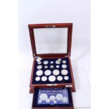 U.S. a teak one-drawer cabinet with glass hinged top, containing ‘A Century of U.S. Silver Coin