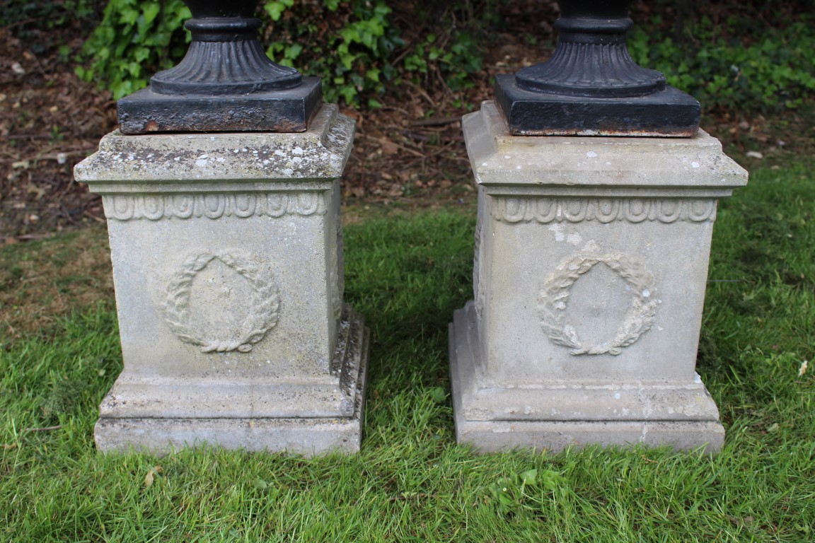 Pair of cast iron urns, campana form with removable rim, black painted, 55cm high, raised on - Image 4 of 4