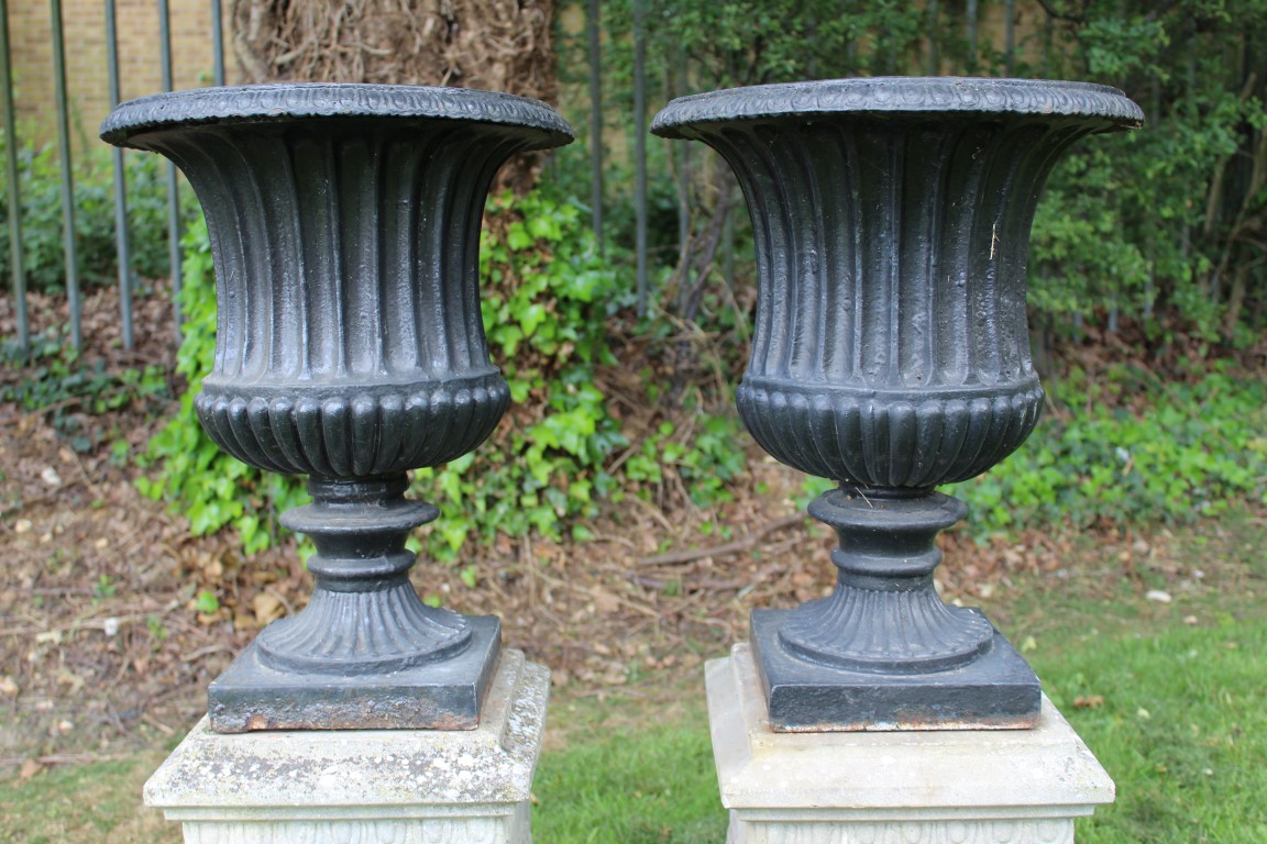 Pair of cast iron urns, campana form with removable rim, black painted, 55cm high, raised on - Image 3 of 4