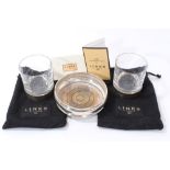 Two Links of London contemporary silver mounted glass tumblers and a silver wine coaster.
