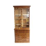 Victorian flamed Mahogany bookcase on chest by Merryweather & Son, London