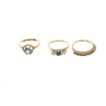 Three gold (9ct) gem set dress rings