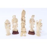 Chinese carved ivory figure of boy holding a barrel on his head and four other figures