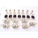 Set of seven silver plated mustards, seven matching salts, seven matching peppers, fourteen spoons