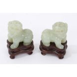 Pair of carved jade or green hardstone figures of temple lions