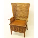 Antique oak framed Orkney chair, with woven bowed back and solid seat on chequer frieze and square