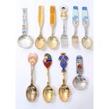 Six Danish enamelled silver Christmas spoons and two forks by Anton Michelsen, Andersen and Tostrup