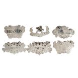 Six silver decanter labels - various