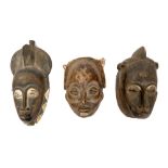 Antique carved Chokwe tribe mask and two further tribal masks
