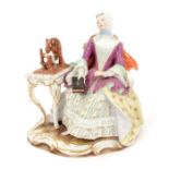 19th century Meissen outside decorated figure of a seated lady holding a bible