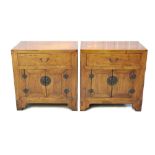 Pair of Chinese elm bedside tables with single drawer and cupboard below with brass handles, 63cm