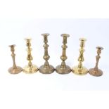 Three pairs of 18th / 19th century brass candlesticks, the tallest 28cm