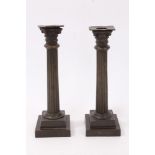 Pair of 19th century bronze Corinthian column candlesticks