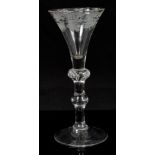 18th century wine glass with vine engraved trumpet bowl