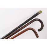 Unusual Irish carved bog oak walking stick, 19th century patridgwood cane and another cane