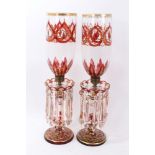 Pair Victorian red and gilt decorated glass storm lamps