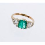 Emerald and diamond three stone ring, emerald 1.71cts, estimated total diamond weight 1.70cts