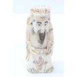 Chinese carved ivory deity figure depicted holding a ruyi sceptre