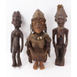 Yoruba tribe fertility figure and two other female fertility figures