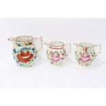 Three graduated 19th century pottery jugs