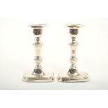 Pair of George V silver candlesticks with knopped stems