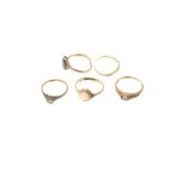 Three gold (9ct) gem set rings, two gold (18ct) rings