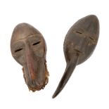 Early Ivory Coast Dan baboon mask, 30cm high and a similar toucan mask