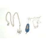 1950s silver pendant of abstract design on chain and lapis lazuli and silver pendant on chain