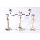 1920s silver three-light candelabrum and pair of contemporary silver candlesticks