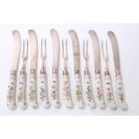 Collection of porcelain-handled silver knives and twin-pronged forks