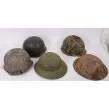 Group of various military helmets to include American Army M1917 steel helmet, two Second World War