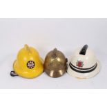 French brass fire helmet, an Essex fire brigade helmet and a London fire brigade helmet (4)