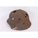 Second World War Nazi M40 Pattern Steel helmet in ‘relic’ condition, believed to have been
