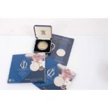 Three Royal Mint coin presentation packs and a comm. medallion