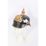 Reproduction Imperial German Picklehaube helmet of leather construction with gilt eagle badge