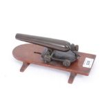 Late 19th century bronze signalling cannon on wooden base