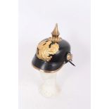 Reproduction Imperial German Picklehaube helmet of leather construction with gilt eagle badge