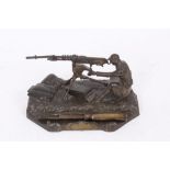 Unusual French Novelty Diecast inkwell in the form of a machine gunner at his post, with plaque-