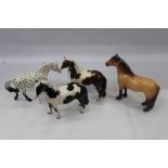 Four Beswick horses - Appaloosa, Spotted Walking Pony, Piebald, Skewbald and Highland