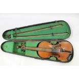 19th century violin with one piece back and traces of an old label, with two bows in a fitted case.