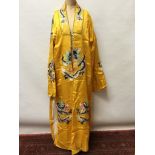 Chinese yellow robe with embroidered dragons.