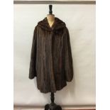 1930s brown mink fur coat with wide sleeves.