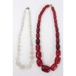 1930s simulated cherry amber bead graduated necklace and a 1930s opaline bead necklace