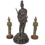 Victorian spelter figure of a soldier in the Rifle Volunteers, mounted on a turned wooden plinth,