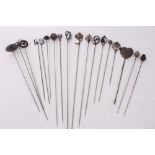 Eighteen Edwardian silver hatpins including Imperial Russian niellowork hatpin