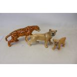 Three Beswick models - Leopard, Lioness and Lion cub