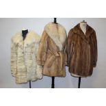 Belted blond mink jacket, a mink coat, one mink stole, one fox, others