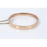 Gold (9ct) expanding bangle with retaining chain